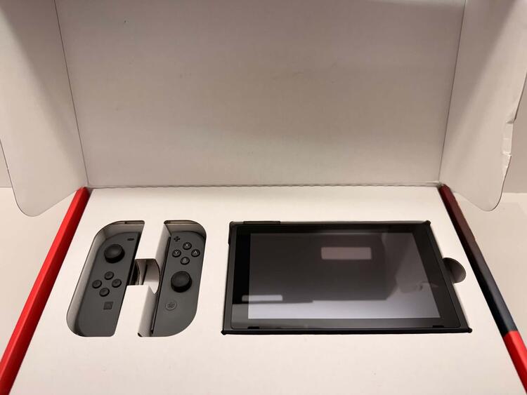 NINTENDO SWITCH MODEL 2 RED AND BLUE + CARRY CASE + 64 GB SD CARD (used)