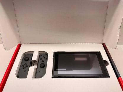 NINTENDO SWITCH MODEL 2 RED AND BLUE + CARRY CASE + 64 GB SD CARD (used)