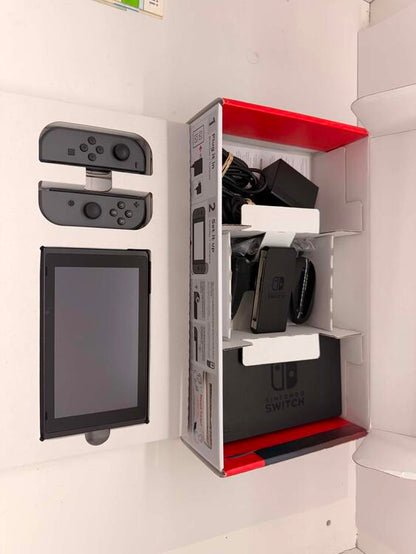 NINTENDO SWITCH MODEL 2 RED AND BLUE + CARRY CASE + 64 GB SD CARD (used)
