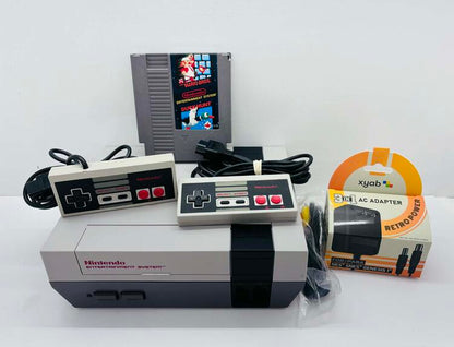 NINTENDO ENTERTAINMENT SYSTEM + 2 CONTROLLERS + SUPER MARIO BROS. (usagé)